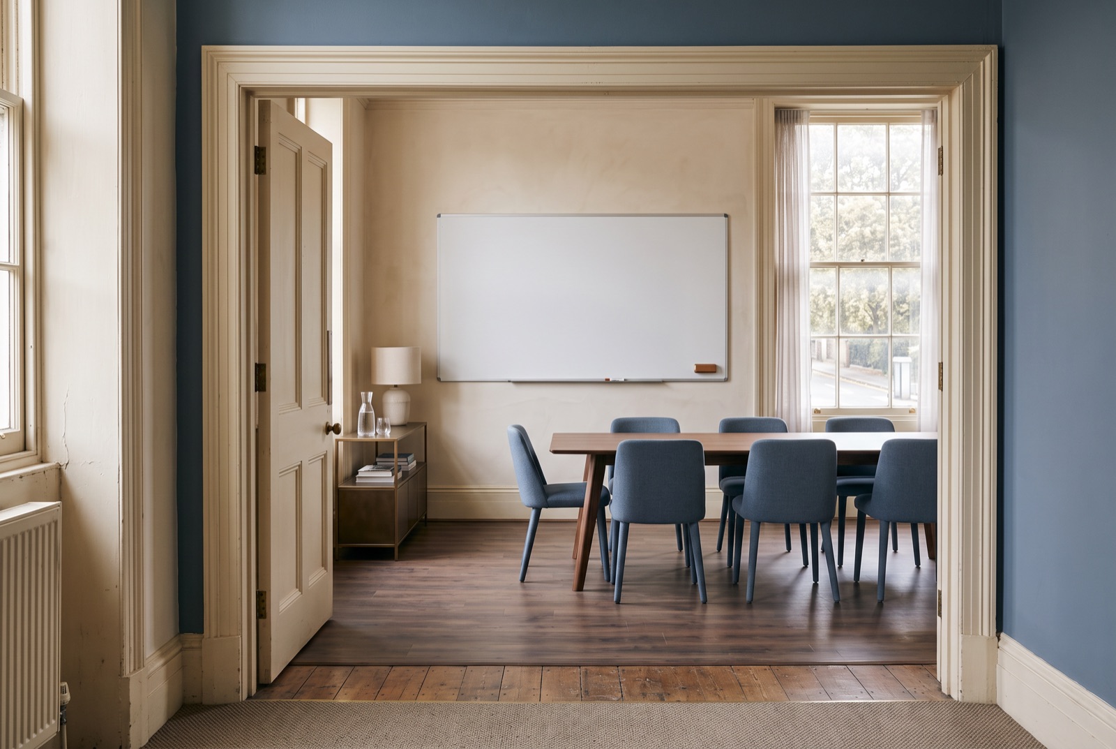 A founders' forum room with a clean whiteboard and morning light