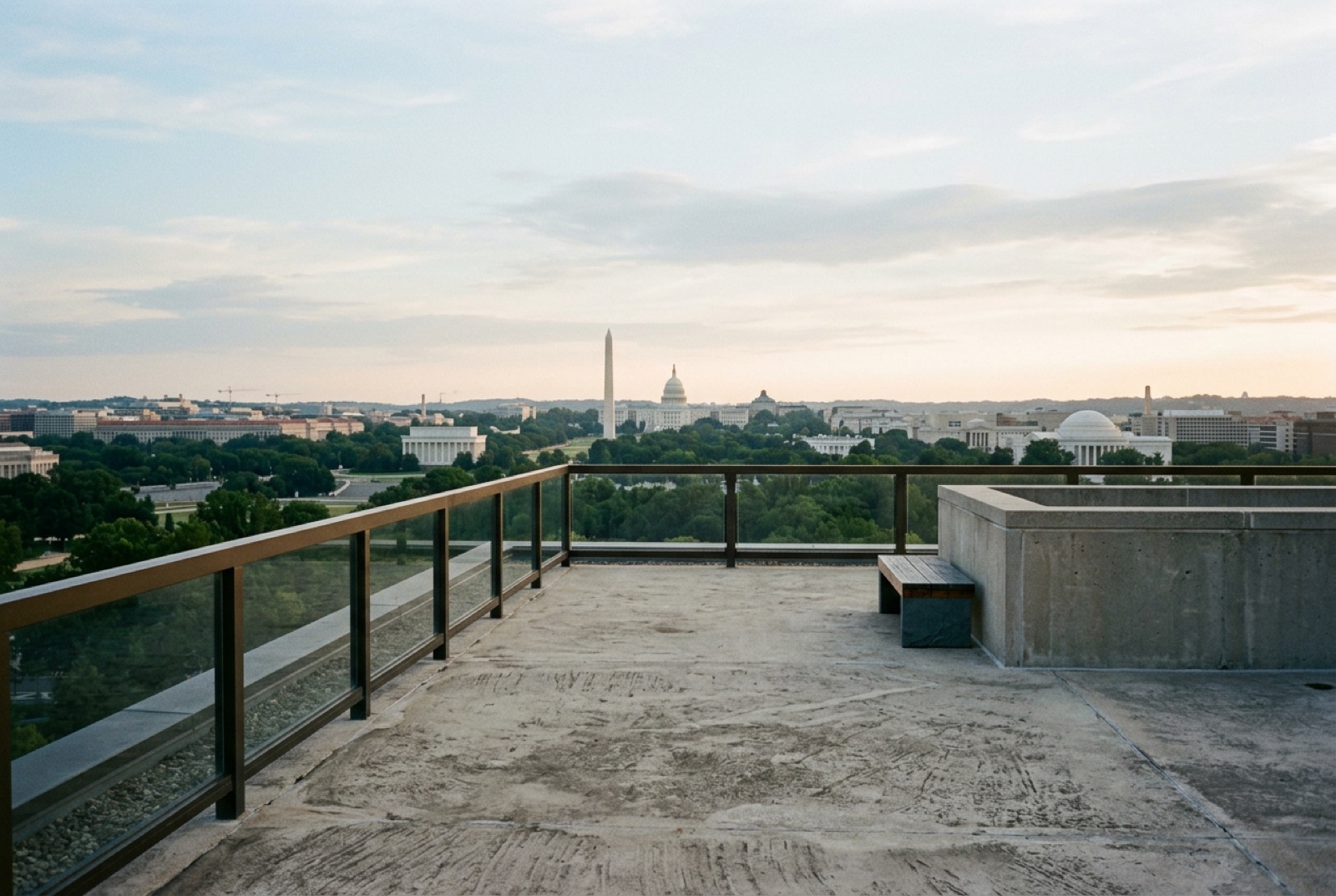 A rooftop of a new building with the city beyond