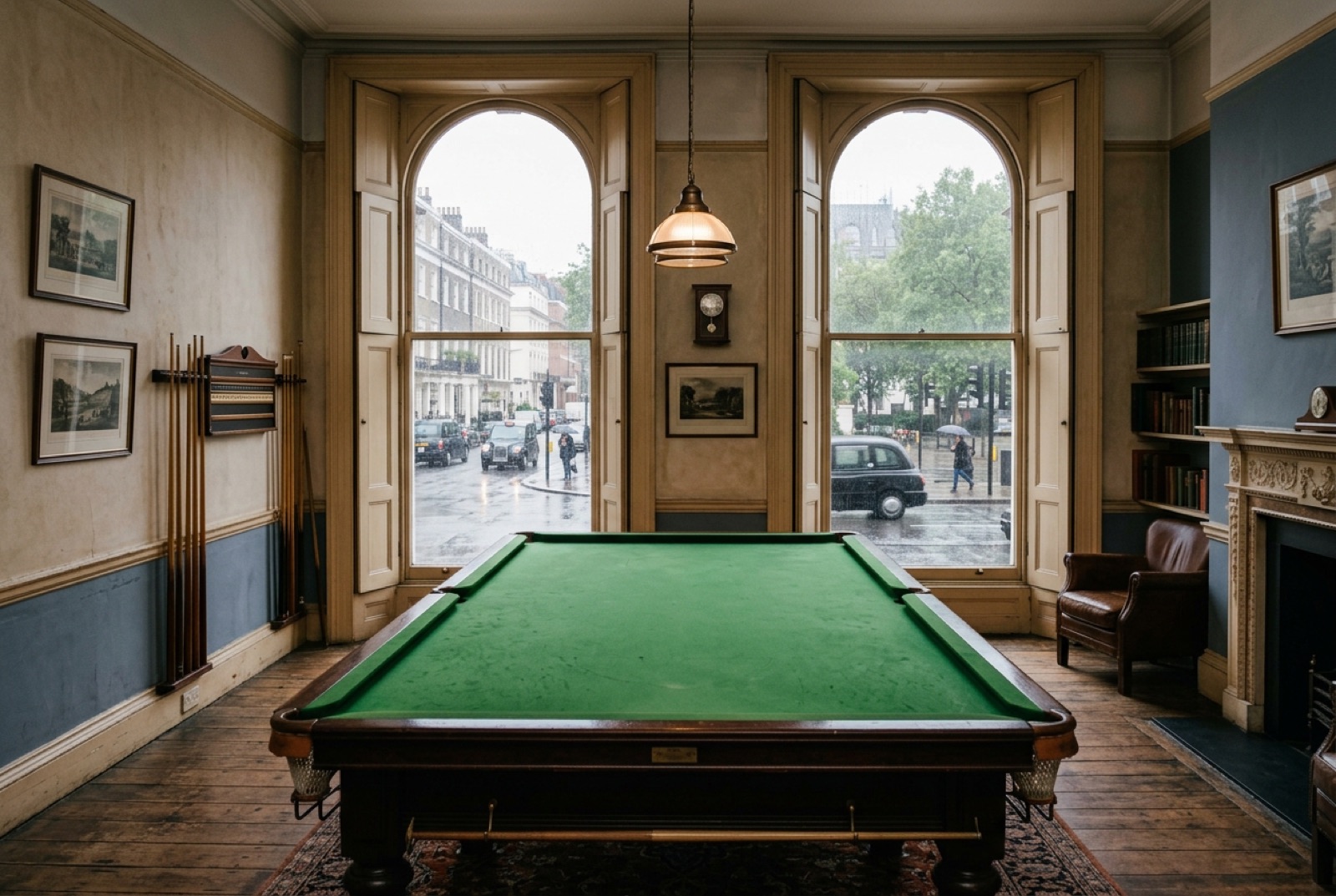 A billiard room with green baize and tall shuttered windows