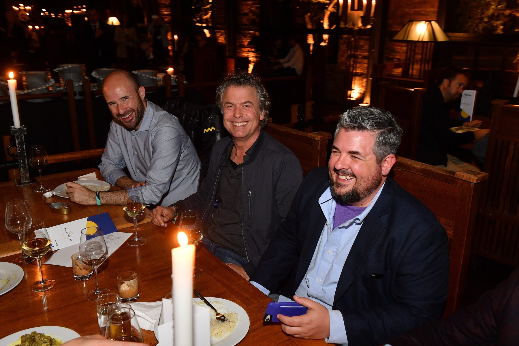 Guests talking over a private dinner in Lisbon